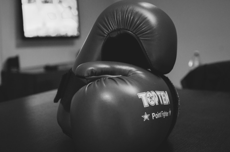 exercising, white, portrait, shadow, black-and-white, one person, boxer, athlete, gloves, focus on foreground, human representation, representation, strength