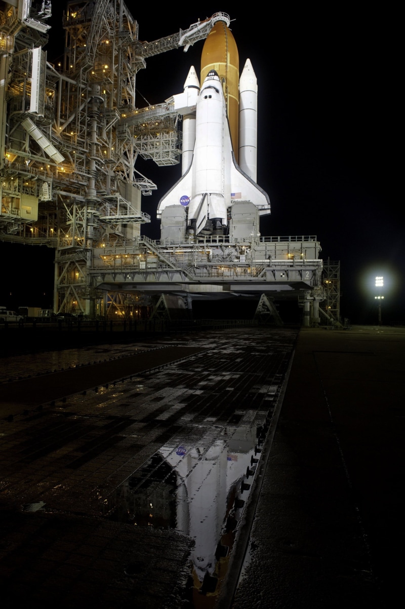 transportation, white, reflection, pre-launch, building, space, illuminated, 2K, photo, road, ship, no people, launch pad, sky, rollout, nasa, city, water