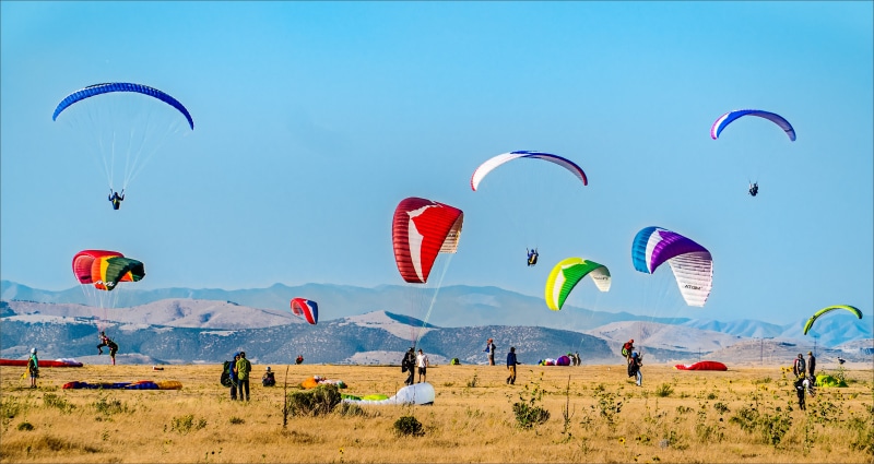 freedom, trip, speed, soaring, group of people, nature, leisure, green, scenery, thermals, mountains, paragliders, transportation, extreme, motion, danger