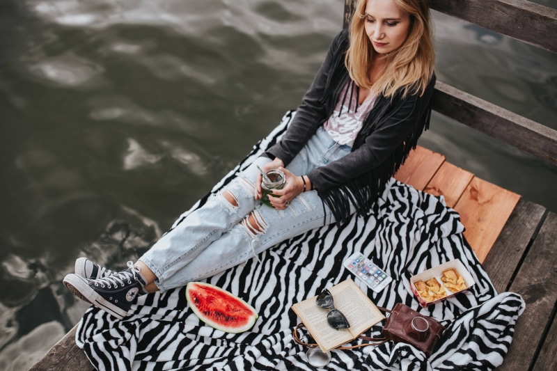 converse, pier, Blonde, lifestyles, sitting, leisure activity, casual clothing, woman, watermelon, river, women, three quarter length, real people, adults only