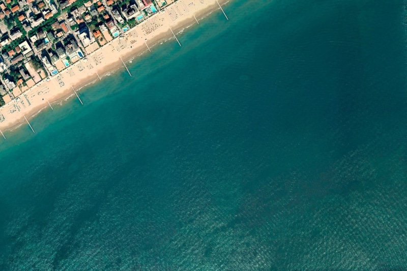vacations, village, building exterior, sand, sunny, photography, no people, body, day, high Angle View, aerial View, swimming pool, cityscape, blue, aerial