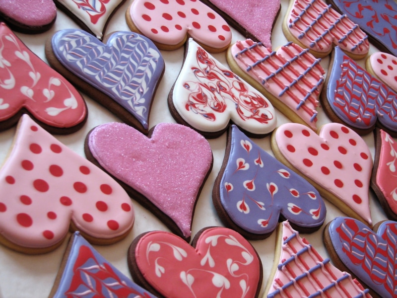 pink color, day, valentines day - holiday, pattern, heart shape, backgrounds, heart, high angle view, temptation, sweet, food, indulgence, sweet food, floral pattern
