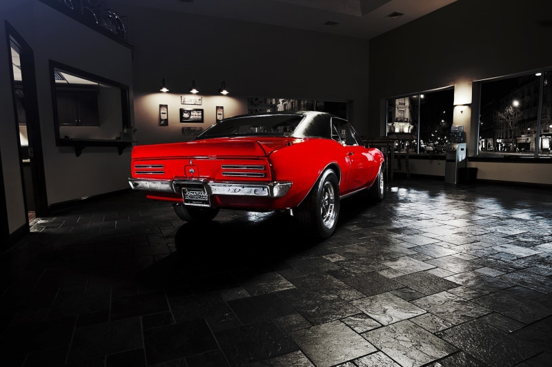 vehicle, architecture, night, outdoors, land vehicle, transportation, stationary, garage, building exterior, illuminated, street, red, Pontiac Firebird