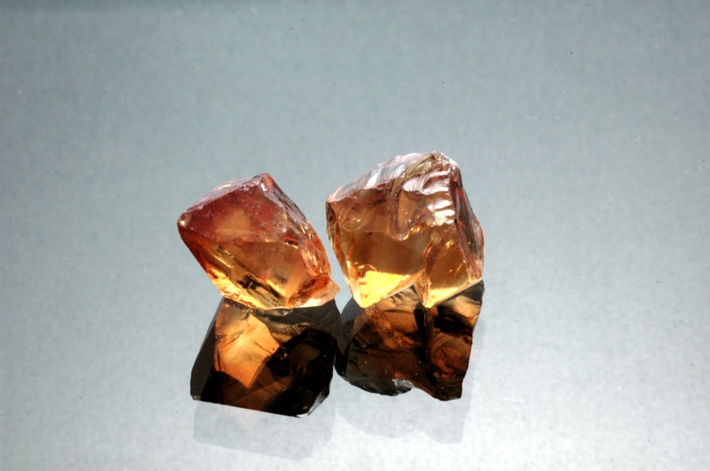 gemstone, indoors, crystal, mineral, specimen, citrine rough, luxury, reflection, single object, rock - object, solid, wealth, gems, gemstones, quarts
