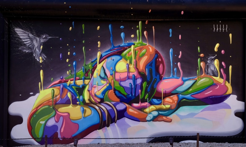 indoor play area, graphics, no people, day, inflatable, low angle view, art and craft, representation, bus stop, human representation, woman, animal, sleeping