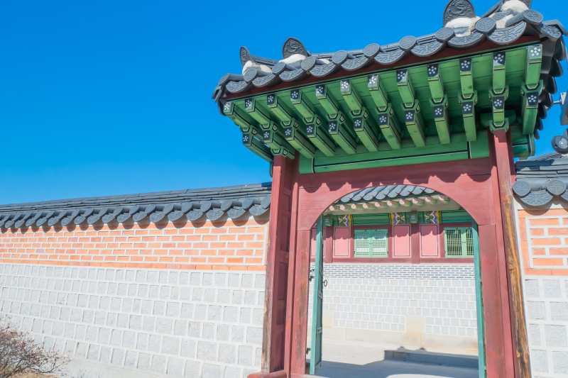architecture, bus stop, clear sky, day, open, cushion, gate, place of worship, building exterior, pillow, outdoors, porch, nature, pergola, no people, seoul