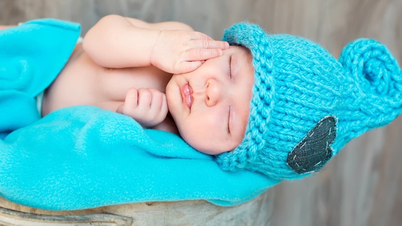 babyhood, lying down, baby, textile, one person, woolly hat, sleeping, child, young, toddler, cute, eyes closed, childhood, turquoise colored, relaxation