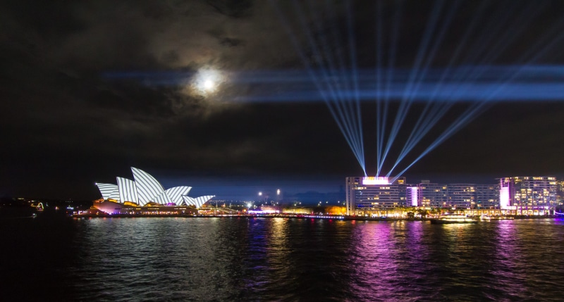 waterfront, laser, light ray, photoholgic, arts culture and entertainment, iconic landmark, moonlight, no people, architecture, cityscape, sky, outdoors
