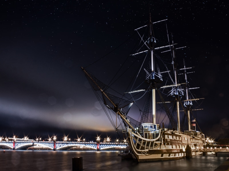 near, sea ​​port, mast, arts culture and entertainment, sailboat, landscape, the ship, connection, clear sky, bridge - man made structure, star - space