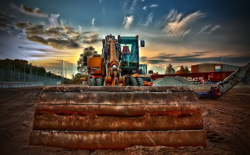 outdoors, construction equipment, industrial equipment, mode of transportation, sea, building - Activity, machine, machines, bulldozer, city, nature, cat