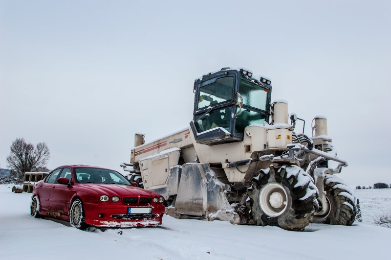 winter, land, day, land vehicle, sedan, motor vehicle, mode of transportation, snow, field, white color, Jaguar, beside, clear sky, car, beige, red, nature