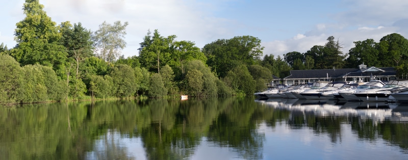 trees, scenics - nature, environment, beauty in nature, calm water, nature, blue sky, tranquility, boats, water, architecture, cloud - sky, nautical vessel