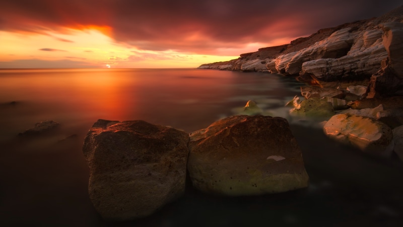 cloud - sky, nature, solid, dramatic sky, no people, scenics - nature, reflection, outdoors, rock, sunset, sea, rock - object, beauty in nature, orange color
