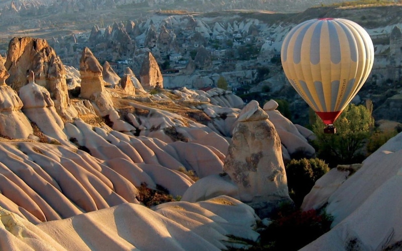 transportation, hot air balloon, Cappadocia, turkey, mountain, balloon, outdoors, sunlight, travel, rock formation, mid-air, rock, flying, air vehicle