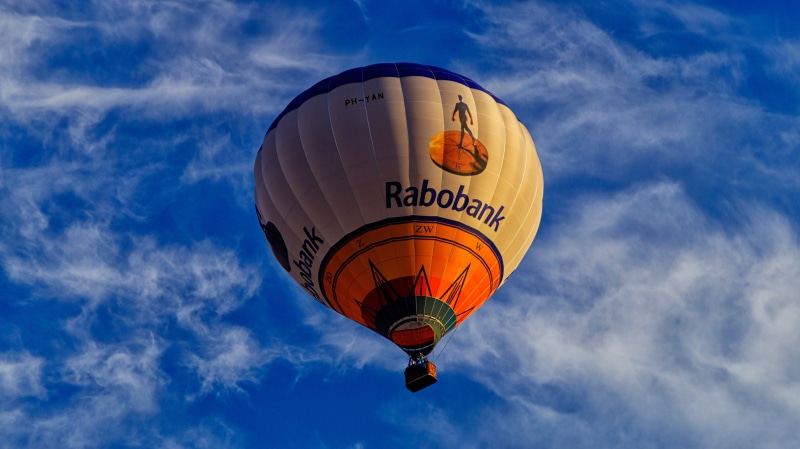 building exterior, vessel, transportation, hot air balloon, outdoors, netherlands, rabobank, cloud - sky, mode of transportation, boating, air, low angle view