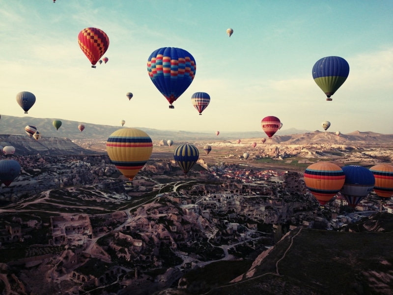 ballooning festival, rock, day, nature legend turkey cappadocia, travel destinations, environment, sky, outdoors, air vehicle, adventure, travel, transportation