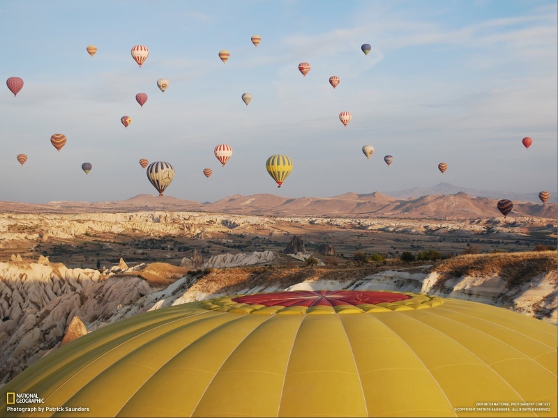 hot air balloons, sky, rock formation, beauty in nature, multi colored, scenics - nature, balloon, mountain, National Geographic, adventure, travel, landscape