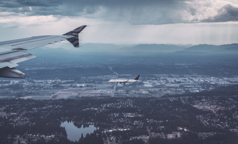 mid-air, plane, nature, airline, mountain range, journey, flying, aircraft wing, aeroplane, public transportation, mountain, fly, clouds, cloud - sky, water