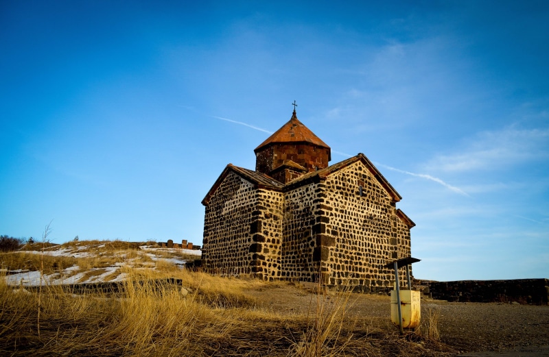 nature, building exterior, christianity, spire, field, architecture, blue, church, plant, place of worship, spirituality, sevan, religion, belief, built structure