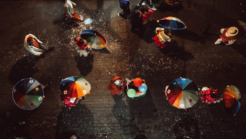 wet, crowd, protection, leisure activity, umbrella, from above, using, large group of people, lifestyles, drone, city, street, multi colored, women, real people