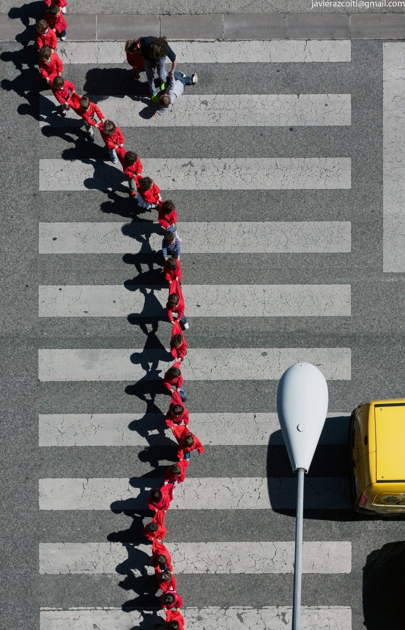 road marking, architecture, dividing line, group of people, people, children, zebra crossing, top view, day, transportation, street, men, high angle view