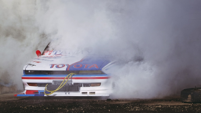 motor vehicle, mark 2, communication, day, JDM, text, smoke - physical structure, 1080P, nature, no people, sign, travel, motion, transportation, public transportation