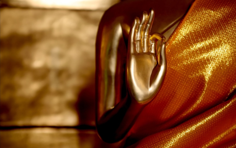 single object, selective focus, figurine, gautama, shape, shiny, 4K, buddha, light, simplicity, textile, arts culture and entertainment, table, no people