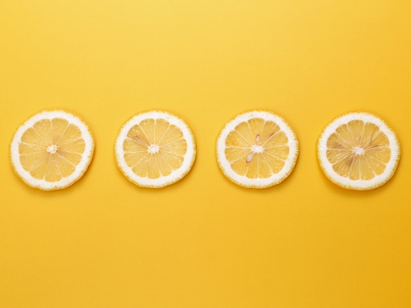 vegetarian food, wellbeing, yellow, minimalism, colored background, no people, food and drink, healthy eating, fruit, lemon, orange - fruit, four, slices