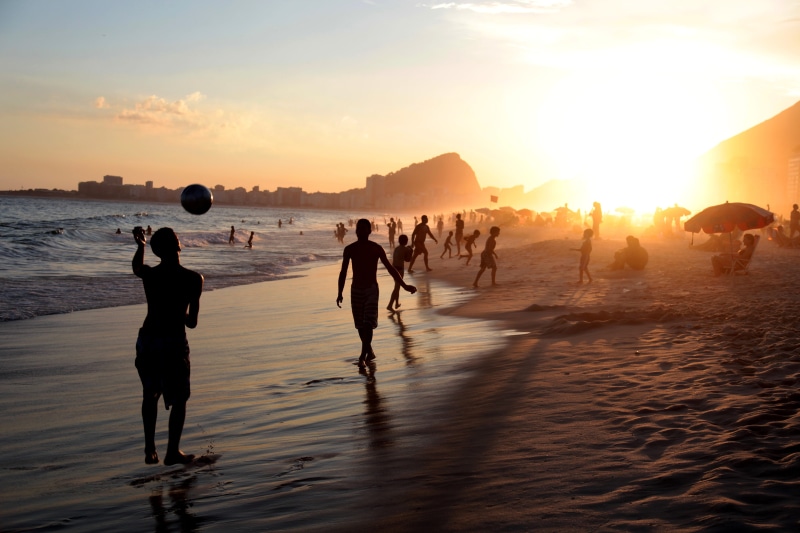 scenics - nature, seashore, outdoors, beauty in nature, land, water, leisure activity, 5K, crowd, nature, sunlight, rio, sunset, soccer, beach, rio de janeiro