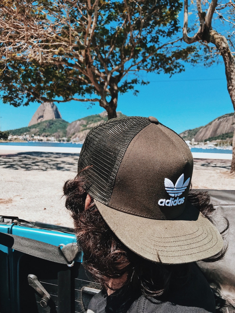 real people, rj, plant, botafogo, sun, sitting, leisure activity, trip, adult, 2K, rear view, winter, hat, travel, state of rio de janeiro, holiday, boy