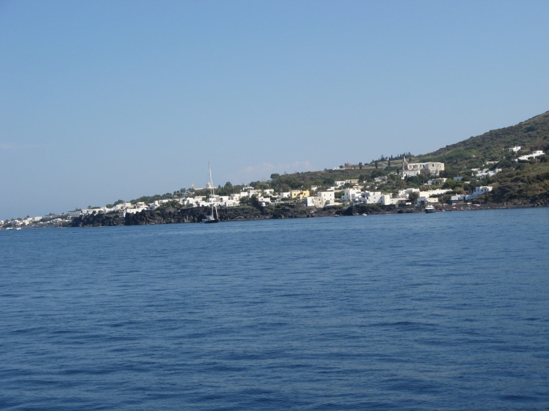 waterfront, calabria, sailboat, beauty in nature, sky, day, 2K, island, built structure, volcano, blue, tranquility, building exterior, water, white houses