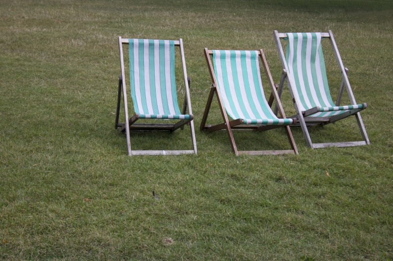 5K, england, folding chair, chairs, green color, no people, absence, land, grass, outdoors, outdoor chair, relaxation, striped, gardens, park, chair, field