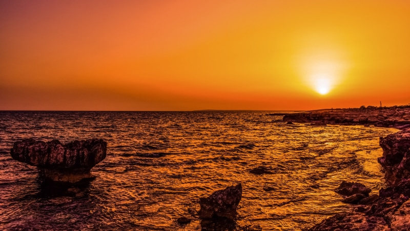 horizon over water, romantic sky, outdoors, sun, scenery, dawn, beach, sea, cyprus, idyllic, backlit, orange color, land, beauty in nature, nature, rocky coast