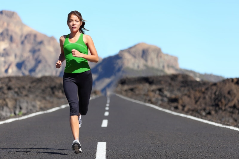 one person, young adult, running, females, nature, front view, athlete, real people, road, leisure activity, healthy lifestyle, fitness  full size, transportation