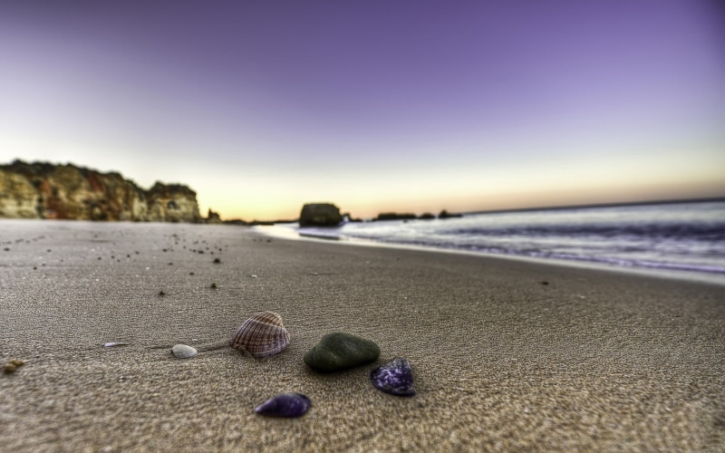 sand, horizon, outdoors, scenics - nature, nature, horizon over water, selective focus, purple, no people, sky, tranquil scene, pebble, tranquility, water