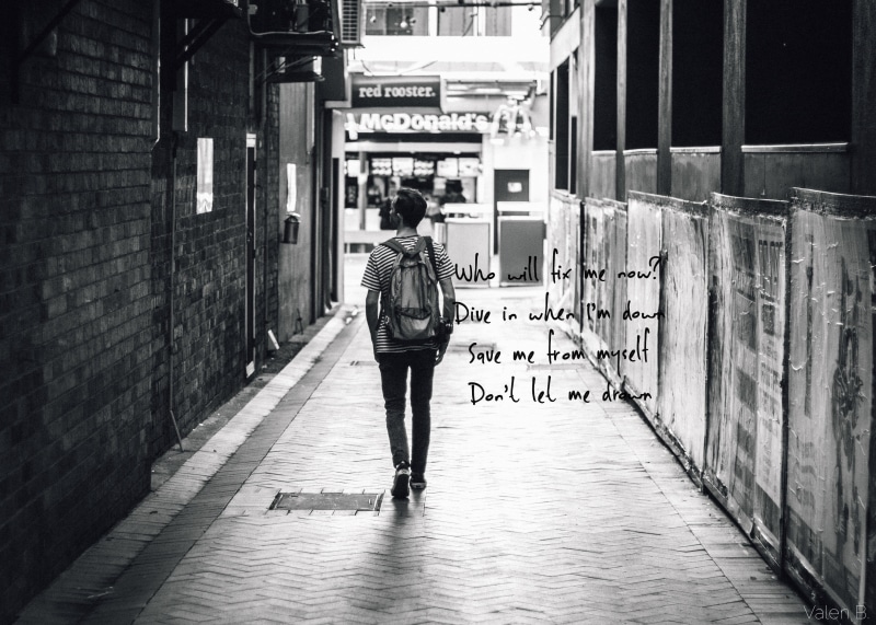 lyrics, city, outdoors, rear view, leisure activity, wooden, full length, table, monochrome, casual clothing, men, architecture, black, direction, day