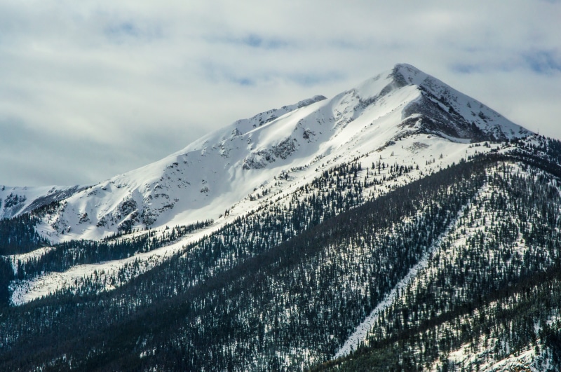 cold temperature, sky, winter, summit, tranquility, mountainous landforms, peak, weather, cloud - sky, plateau, season, snow, geological phenomenon, no people