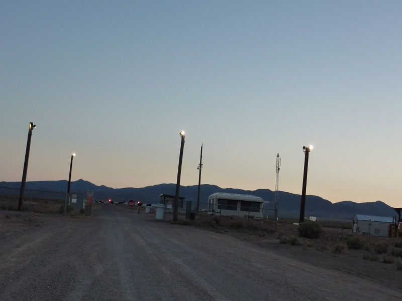 travel destinations, travel, groom lake, aliens, rachel, motor vehicle, diminishing perspective, nature, barriers, sky, ufo, road, outdoors, mode of transportation