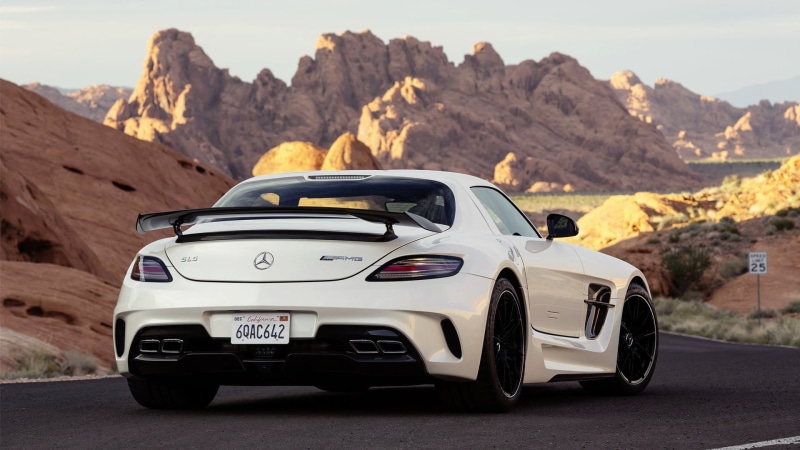 mountain, sky, outdoors, nature, car, Mercedes-Benz, sunlight, transportation, land, mountain range, day, racecar, sls, benz, rock - object, road, mode of transportation