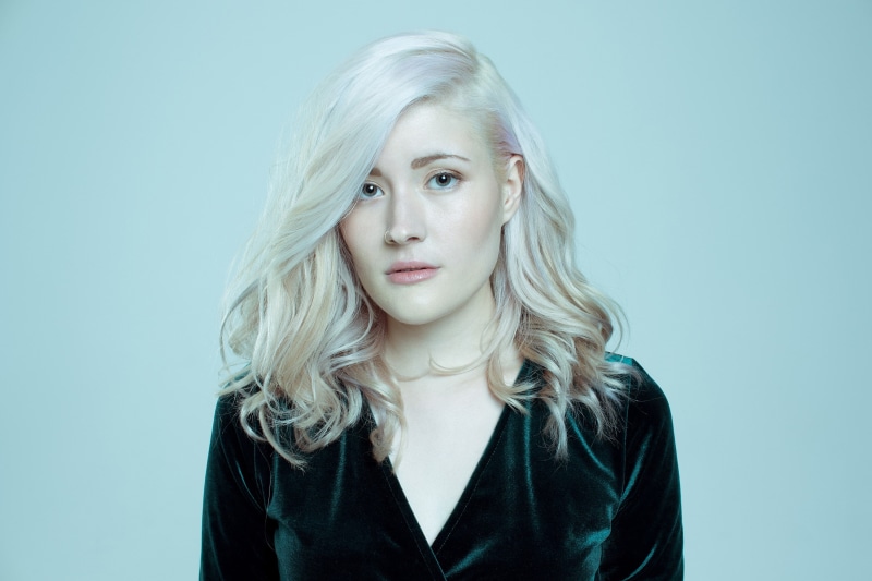 women, beautiful woman, young women, white hair, one person, beauty, colored background, Madeline Juno, hair, 2K, looking at camera, headshot, blue, studio shot