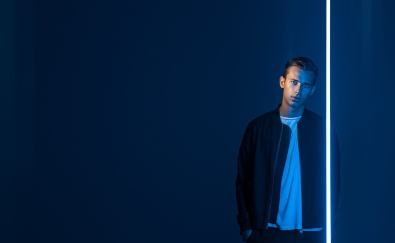 standing, looking away, three quarter length, contemplation, one person, flume, copy space, 720P, black background, adult, studio shot, young adult, front view