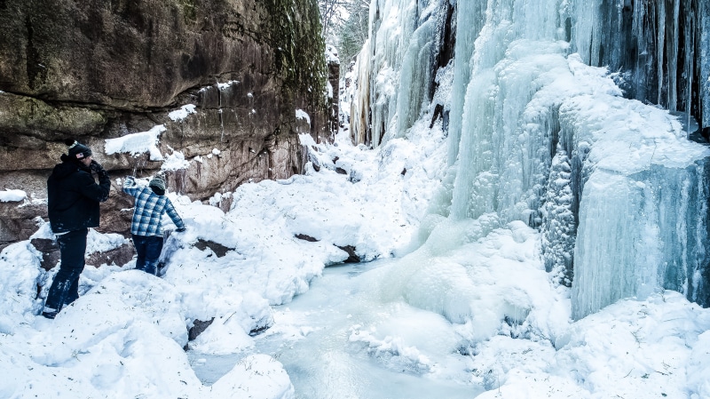 adventure, extreme weather, warm clothing, real people, wilderness, hiking, flume gorge, nature, activity, beauty in nature, snow, winter, scenics - nature