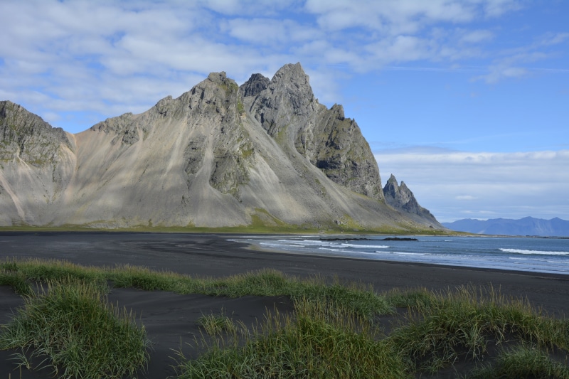 igneous rocks, water, beside, scenics, mountain peak, landscape, body, southeast iceland, nature, vestrahorn mountain, outdoors, mountain range, iceland