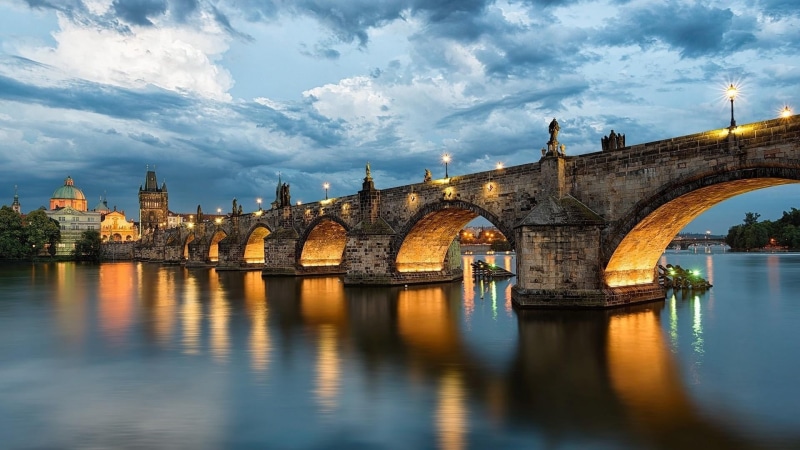 bridge, arch, cityscape, sky, landmark, river, arch bridge, cloud - sky, transportation, vltava river, tourism, cloud, czech republic, city, connection