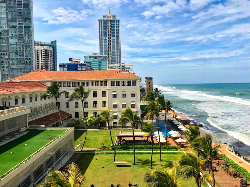 office building exterior, building exterior, skyscraper, cloud - sky, sea, plant, tower, day, colombo, building, 4K, ocean, horizon over water, beach