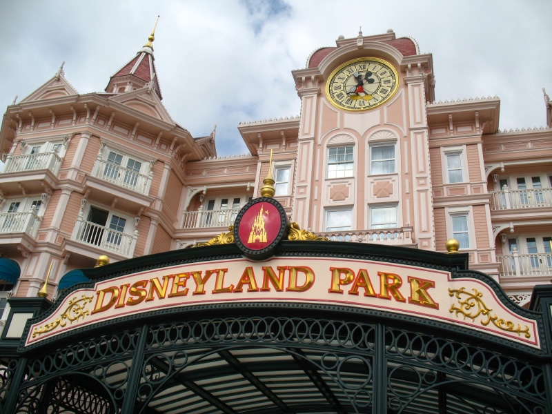activity, nature, amusement park, entrance, amusement, built structure, theme park, travel, clock, sky, building exterior, city, western script, cloud - sky