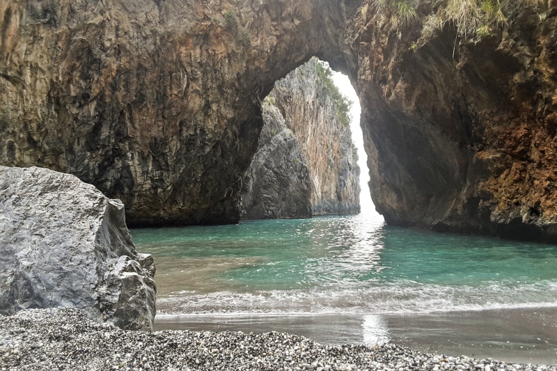 non-urban scene, arch, rock - object, land, sea, outdoors, rock, formation, geology, rock formation, water, physical geography, scenics - nature, natural arch