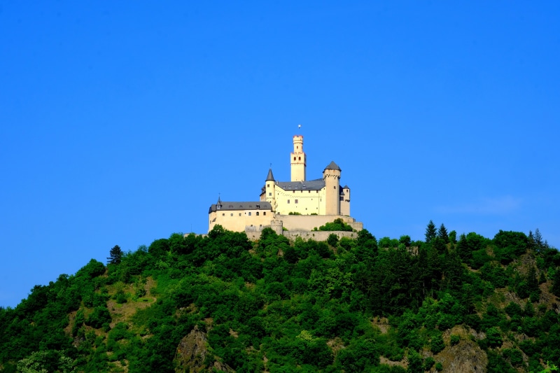 sky, masonry, spire, the past, built structure, fortress, historically, blue, view, no people, forested, place of worship, places of interest, architecture