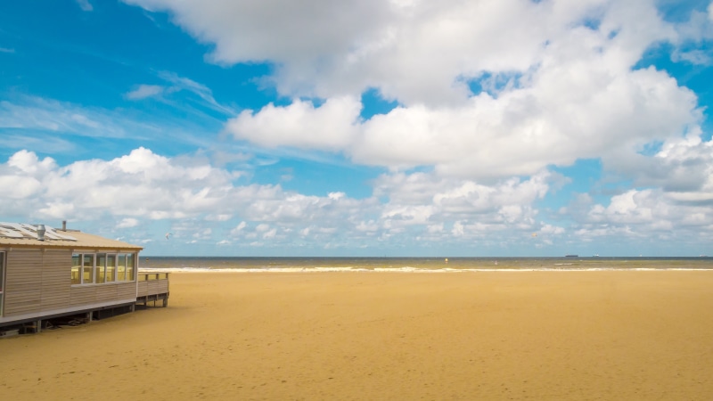 netherlands, shelter, summer, holland, nature, seashore, cloud - sky, ocean, tranquil scene, horizon, wooden, coast, landscape, holiday, sand, blue, coastline