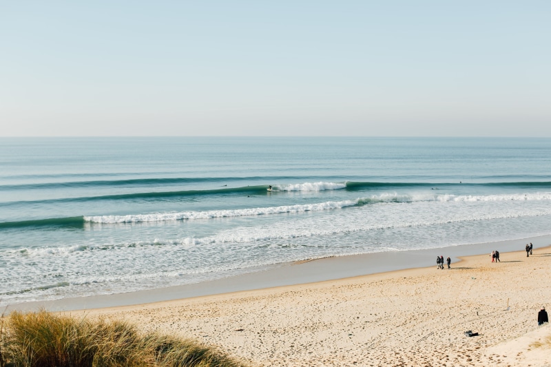adventure, coast, daytime, day, motion, beauty in nature, lineup, tranquility, clear sky, sea waves, human, scenics - nature, person, outdoors, beach, non-urban scene